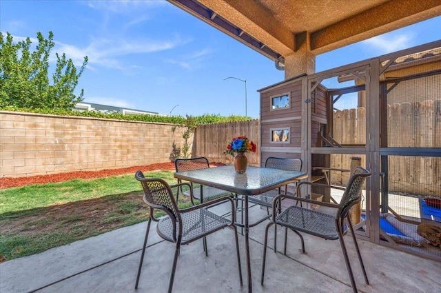2481 S Via Versilia Dr, Fresno, CA 93727 - fenced backyard featuring a patio area and outdoor dining space