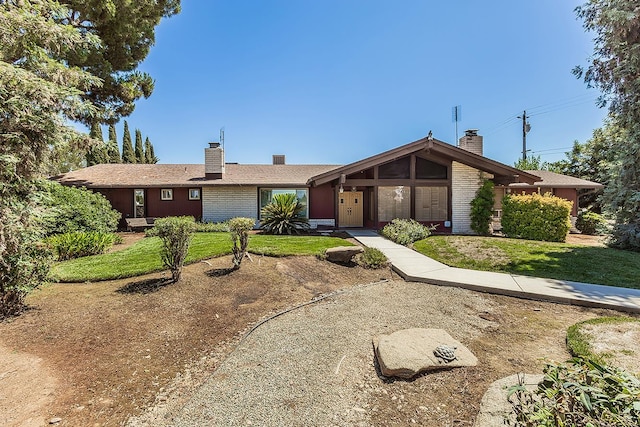 10465 E Herndon Ave, Clovis, CA 93619 - view of front facade featuring a chimney and a front yard