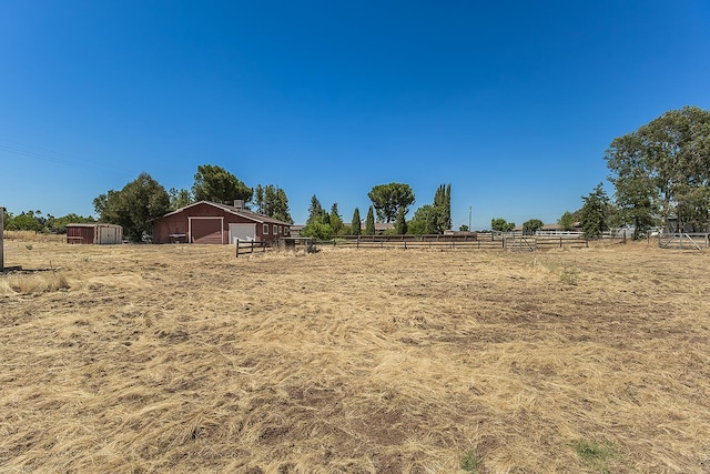10465 E Herndon Ave, Clovis, CA 93619 - view of yard with a view of countryside, an outdoor structure, and a garage