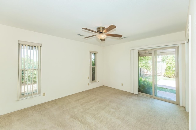 10465 E Herndon Ave, Clovis, CA 93619 - spare room with light carpet, plenty of natural light, and a ceiling fan
