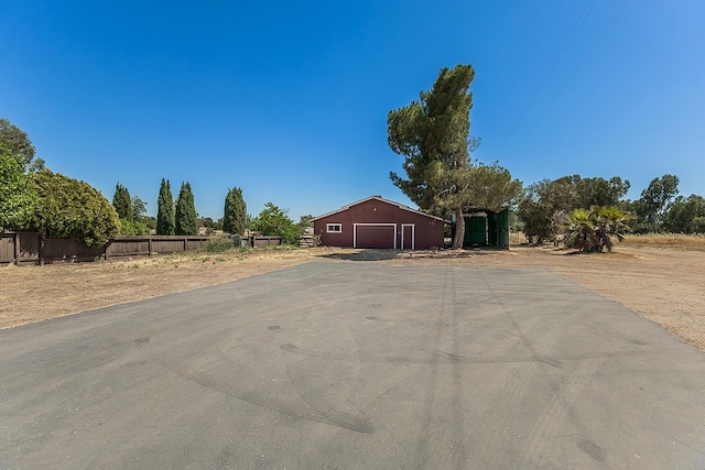 10465 E Herndon Ave, Clovis, CA 93619 - view of asphalt driveway featuring an outbuilding