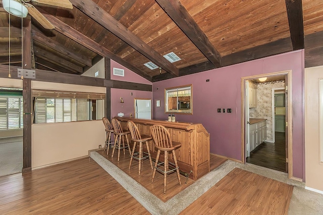 10465 E Herndon Ave, Clovis, CA 93619 - indoor dry bar with a wood ceiling with exposed beams, freestanding refrigerator, stainless steel microwave, ceiling fan, and wood finished floors