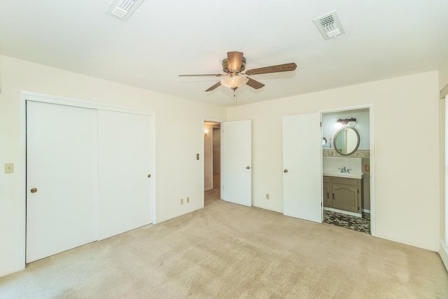 10465 E Herndon Ave, Clovis, CA 93619 - unfurnished bedroom with carpet floors, a closet, ensuite bath, and a ceiling fan