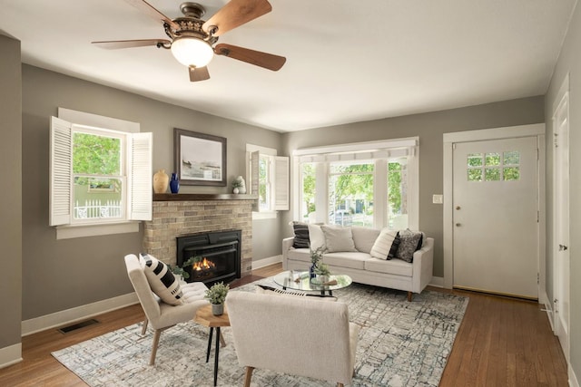 321 E Brown, Fresno, CA 93704 - living room featuring plenty of natural light, wood finished floors, a fireplace, and ceiling fan