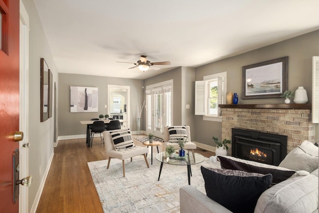 321 E Brown, Fresno, CA 93704 - living area with dark wood finished floors, a fireplace, and ceiling fan