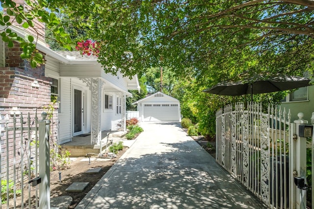 321 E Brown, Fresno, CA 93704 - view of property exterior featuring an outdoor structure and a garage