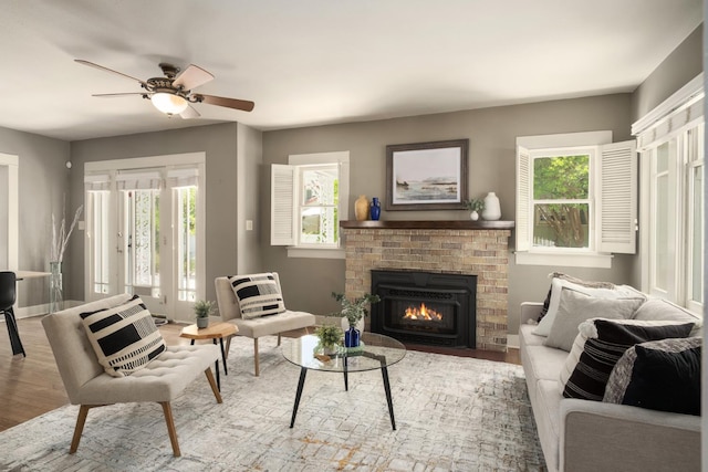 321 E Brown, Fresno, CA 93704 - living area featuring wood finished floors, healthy amount of natural light, and a brick fireplace