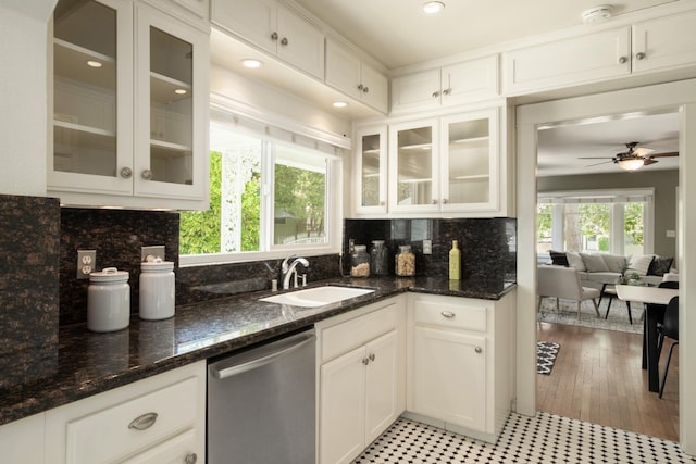 321 E Brown, Fresno, CA 93704 - kitchen featuring stainless steel dishwasher, white cabinets, backsplash, and dark stone counters