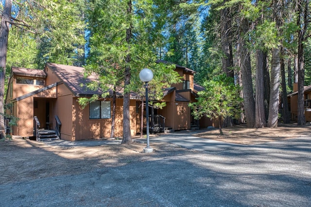 40748 Mill Run Ln Unit 5, Shaver Lake, CA 93664 - view of front of home with gravel driveway and a shingled roof