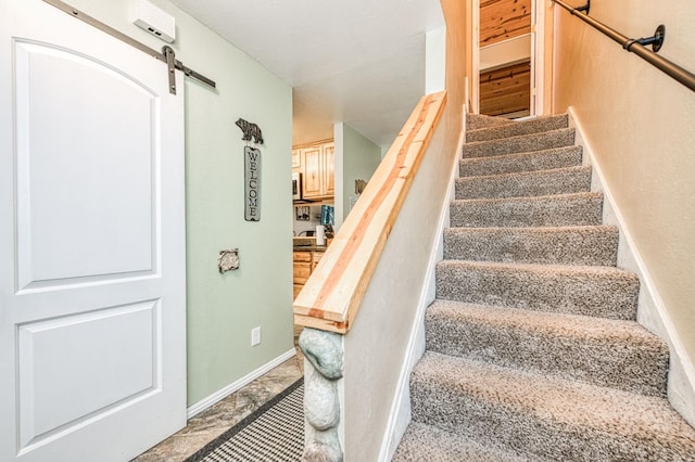 40748 Mill Run Ln Unit 5, Shaver Lake, CA 93664 - stairs featuring a barn door and baseboards