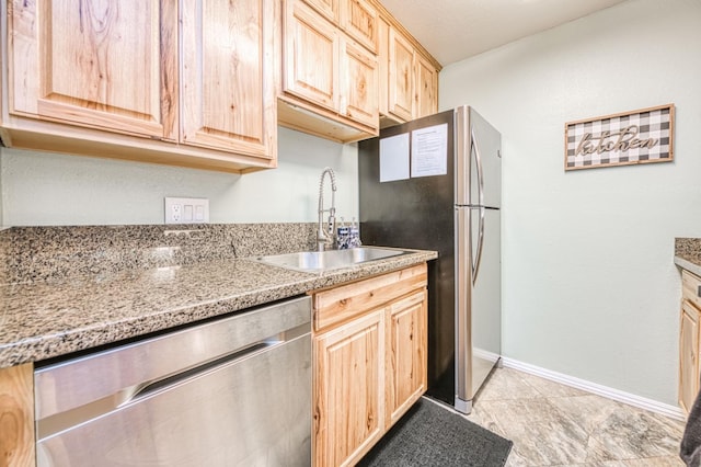 40748 Mill Run Ln Unit 5, Shaver Lake, CA 93664 - kitchen with appliances with stainless steel finishes, light brown cabinets, and light stone countertops