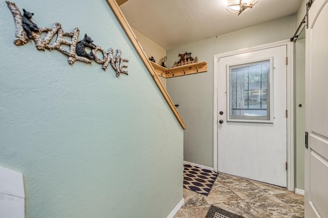 40748 Mill Run Ln Unit 5, Shaver Lake, CA 93664 - doorway featuring baseboards and light stone finish floors