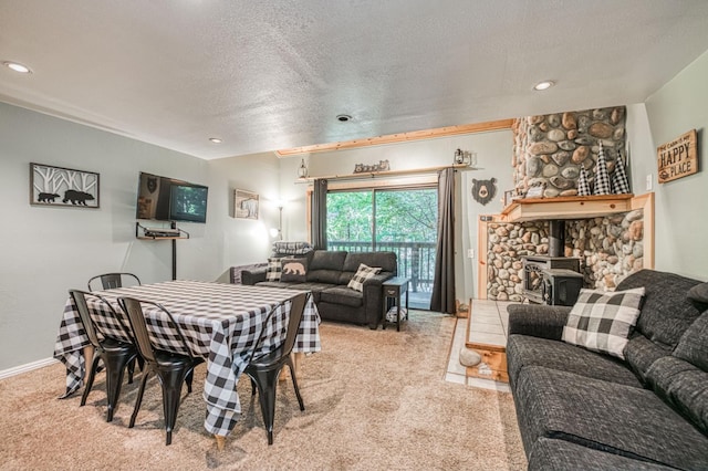 40748 Mill Run Ln Unit 5, Shaver Lake, CA 93664 - dining area with carpet flooring, a wood stove, and a textured ceiling