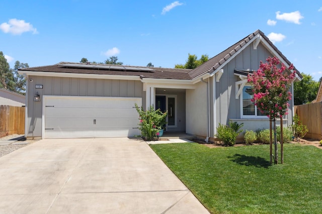1567 Las Rosas Ave, Clovis, CA 93619 - ranch-style home featuring solar panels, an attached garage, and driveway