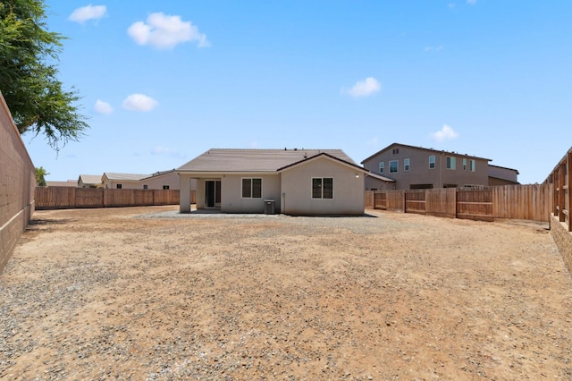 1567 Las Rosas Ave, Clovis, CA 93619 - back of house with a fenced backyard, stucco siding, and a patio