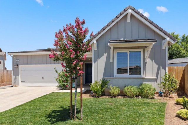 1567 Las Rosas Ave, Clovis, CA 93619 - view of front of house featuring board and batten siding, concrete driveway, and a garage