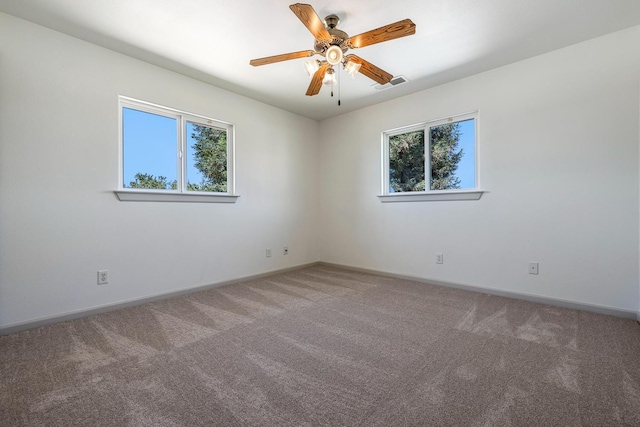 570 S Lassen Ave, Kerman, CA 93630 - carpeted empty room featuring a ceiling fan and baseboards