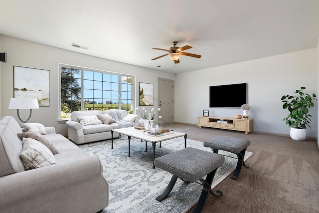 570 S Lassen Ave, Kerman, CA 93630 - living room featuring a ceiling fan and light carpet