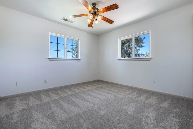 570 S Lassen Ave, Kerman, CA 93630 - spare room featuring plenty of natural light, carpet flooring, and ceiling fan