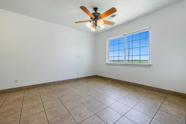 570 S Lassen Ave, Kerman, CA 93630 - empty room with light tile patterned floors and a ceiling fan