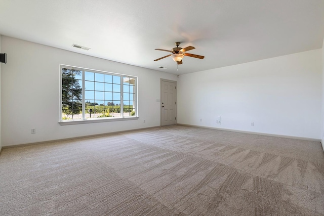 570 S Lassen Ave, Kerman, CA 93630 - spare room with a ceiling fan and light carpet