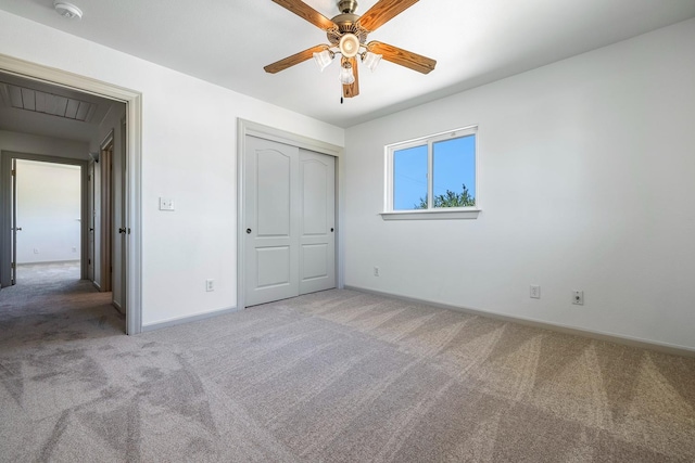 570 S Lassen Ave, Kerman, CA 93630 - unfurnished bedroom featuring carpet flooring, a closet, and ceiling fan