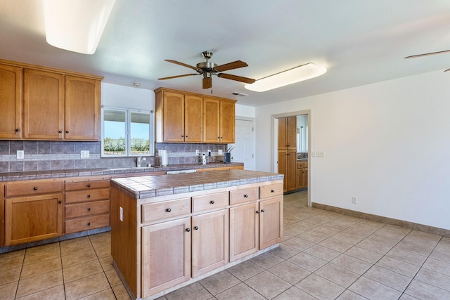 570 S Lassen Ave, Kerman, CA 93630 - kitchen featuring ceiling fan, backsplash, and light tile patterned floors