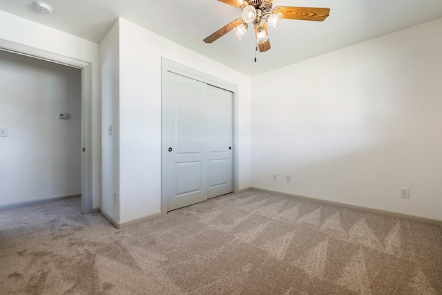 570 S Lassen Ave, Kerman, CA 93630 - unfurnished bedroom with light colored carpet, a closet, and ceiling fan