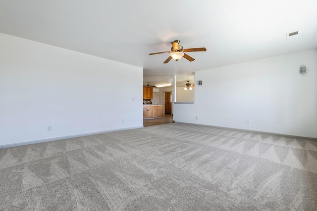 570 S Lassen Ave, Kerman, CA 93630 - spare room featuring a ceiling fan and light carpet