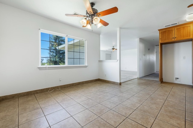 570 S Lassen Ave, Kerman, CA 93630 - spare room with ceiling fan and light tile patterned floors