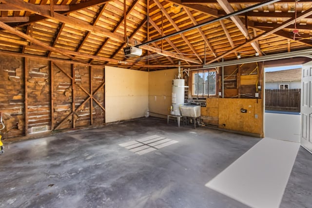 3486 E Lamona Ave, Fresno, CA 93703 - garage with secured water heater and a garage door opener