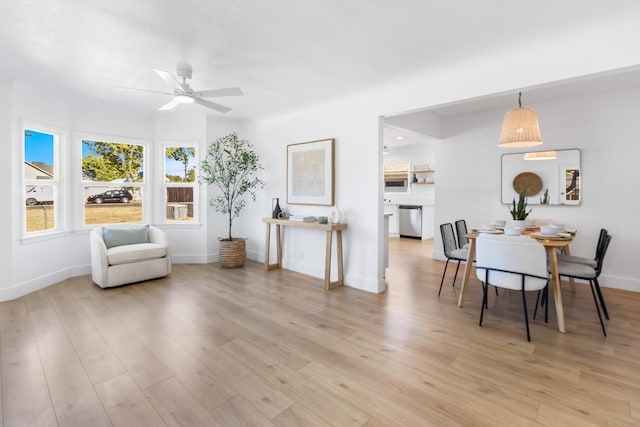 3486 E Lamona Ave, Fresno, CA 93703 - living area with a ceiling fan and light wood-type flooring