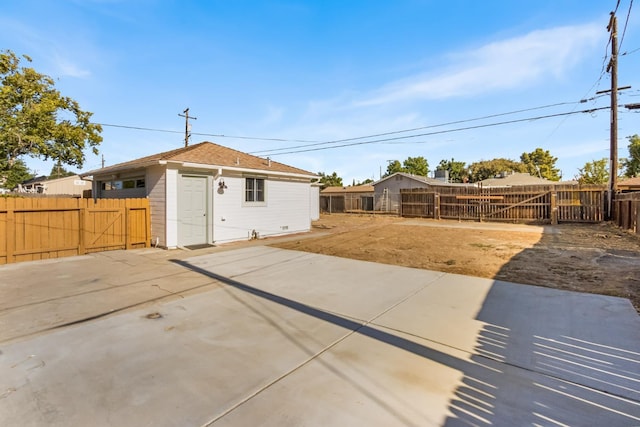 3486 E Lamona Ave, Fresno, CA 93703 - back of property with a gate, a patio area, and a fenced backyard
