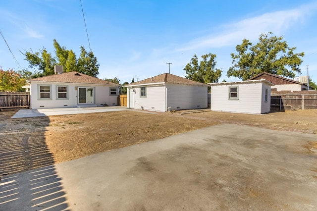 3486 E Lamona Ave, Fresno, CA 93703 - rear view of property featuring a patio and an outdoor structure