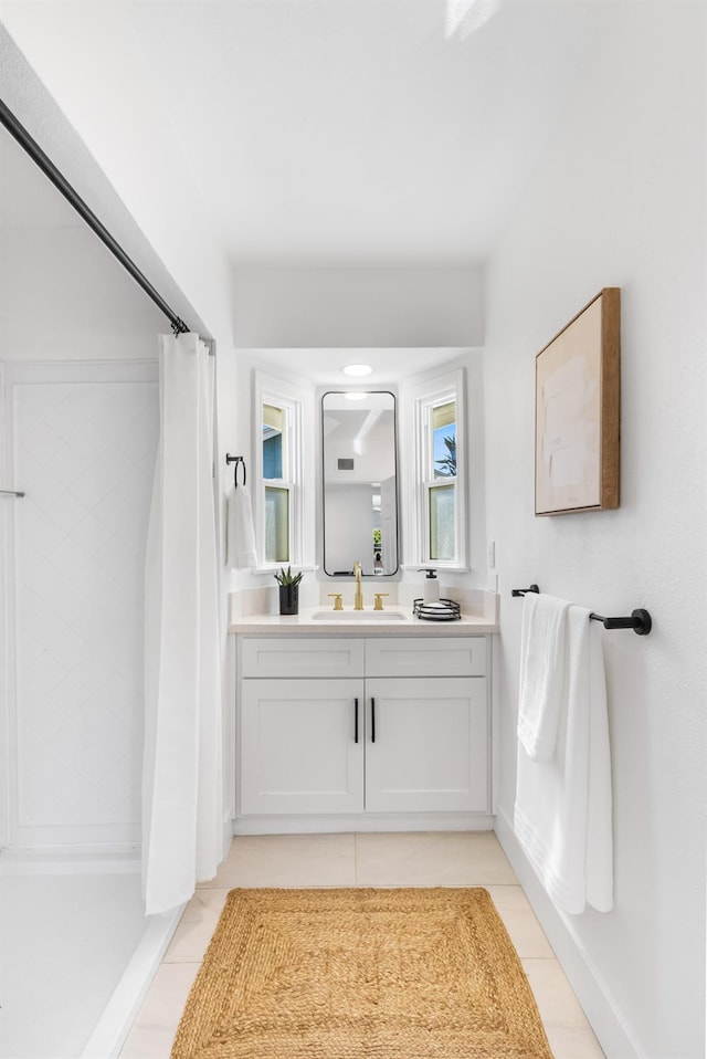 3486 E Lamona Ave, Fresno, CA 93703 - bathroom featuring tile patterned flooring, vanity, and curtained shower