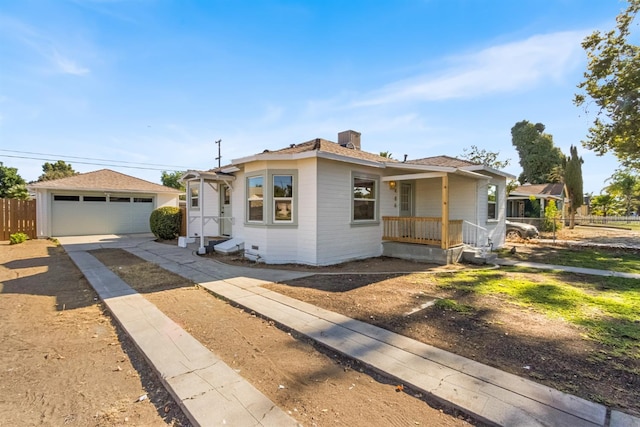 3486 E Lamona Ave, Fresno, CA 93703 - bungalow-style house featuring a garage, an outbuilding, and a chimney