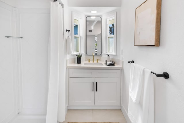 3486 E Lamona Ave, Fresno, CA 93703 - full bathroom featuring vanity, a shower with curtain, and tile patterned flooring