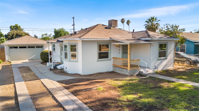 3486 E Lamona Ave, Fresno, CA 93703 - bungalow featuring concrete driveway, a shingled roof, and a garage