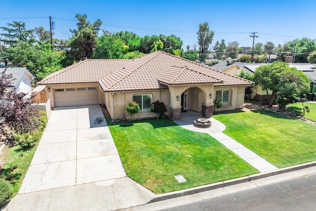 135 N Park Dr, Madera, CA 93637 - mediterranean / spanish home with stucco siding, a tiled roof, an attached garage, and concrete driveway