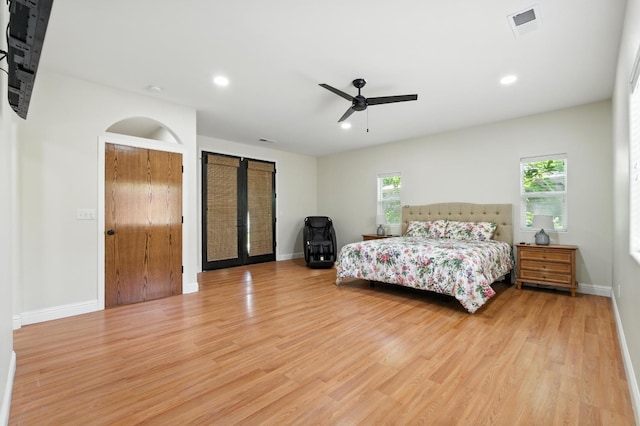 135 N Park Dr, Madera, CA 93637 - bedroom featuring light wood-type flooring, recessed lighting, a ceiling fan, and french doors