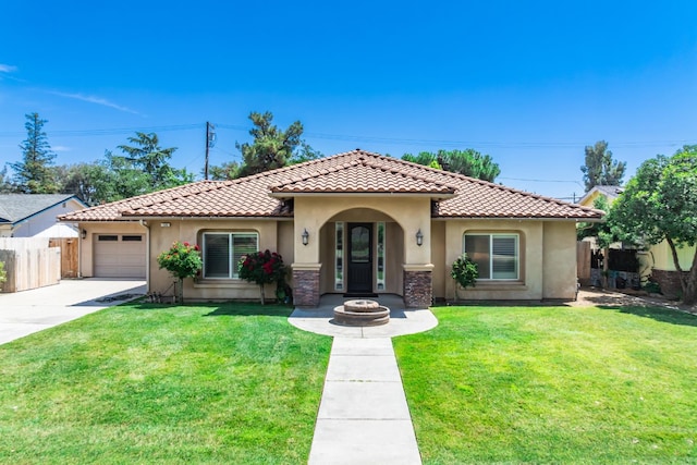 135 N Park Dr, Madera, CA 93637 - mediterranean / spanish house featuring stucco siding, a tiled roof, a garage, and driveway