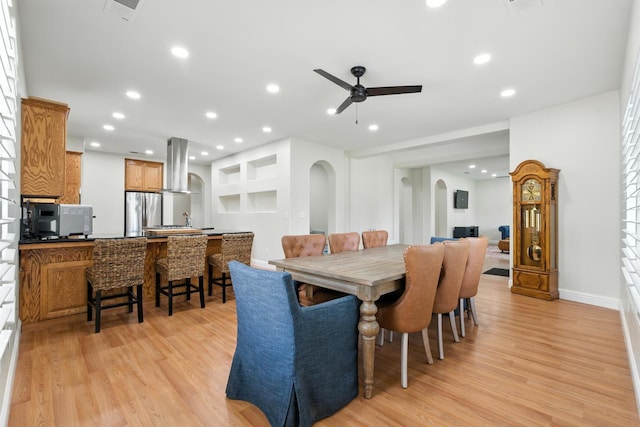 135 N Park Dr, Madera, CA 93637 - dining area featuring light wood finished floors, a ceiling fan, arched walkways, and recessed lighting