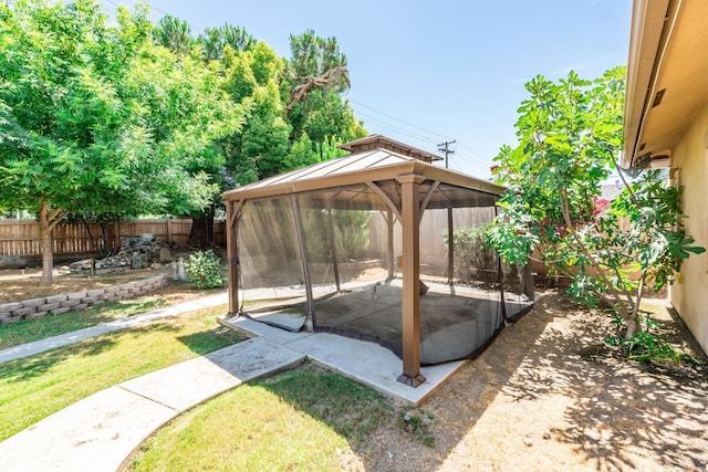 135 N Park Dr, Madera, CA 93637 - fenced backyard with a gazebo and a patio