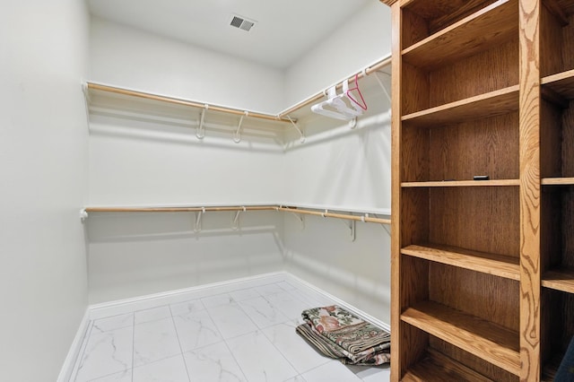 135 N Park Dr, Madera, CA 93637 - spacious closet with marble look tiles