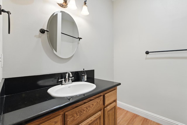 135 N Park Dr, Madera, CA 93637 - bathroom featuring vanity and wood finished floors