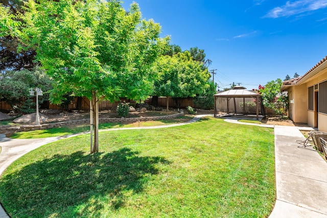 135 N Park Dr, Madera, CA 93637 - fenced backyard with a gazebo