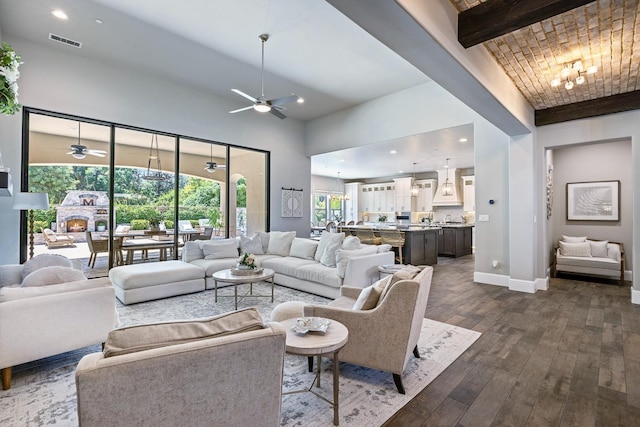 2706 Trenton Ave, Clovis, CA 93619 - living area featuring a ceiling fan, dark wood finished floors, a high ceiling, beam ceiling, and recessed lighting