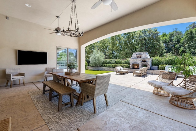 2706 Trenton Ave, Clovis, CA 93619 - view of patio / terrace with an outdoor stone fireplace, a ceiling fan, and outdoor dining area