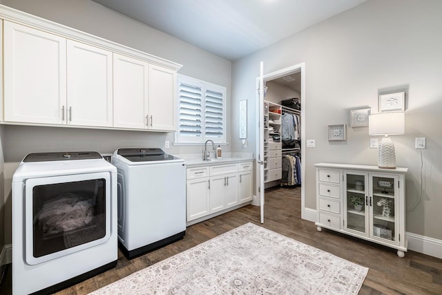 2706 Trenton Ave, Clovis, CA 93619 - laundry room featuring washing machine and dryer, cabinet space, and dark wood finished floors