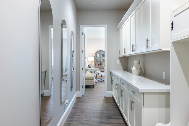 2706 Trenton Ave, Clovis, CA 93619 - corridor with dark wood-type flooring and arched walkways